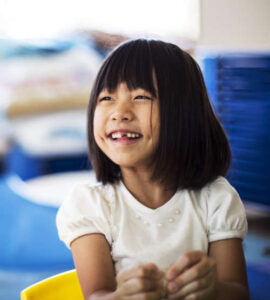 Smiling preschool girl at a daycare in Becker MN