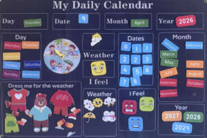 Felt preschool learning calendar showing date, weather, feelings, and daily routine activities
